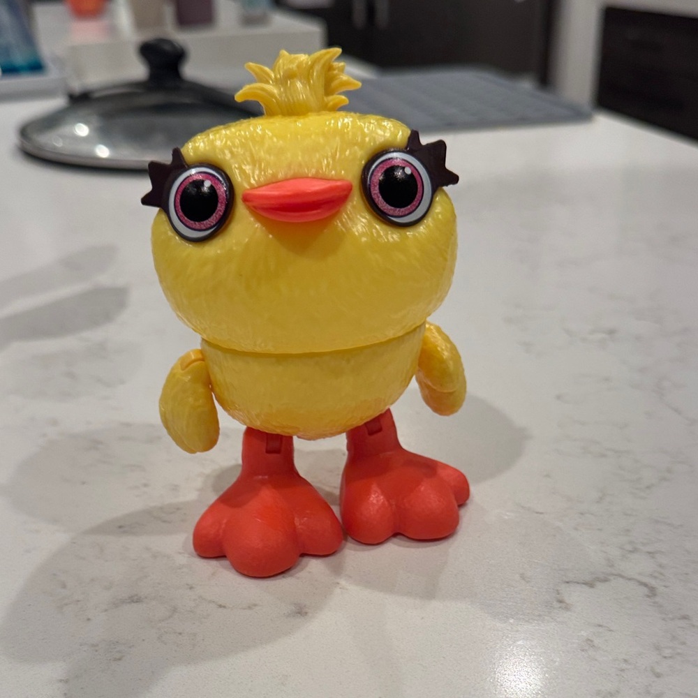 Yellow and Orange Toy Figure
